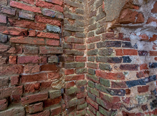 Brick wall of the old ruined house