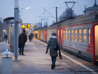 People are waiting for the train arriving at the railway station
