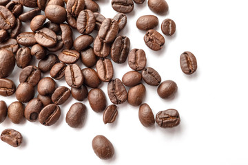 Roasted coffee beans isolated on white background. Close-up.