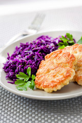Chicken fritters and stewed red cabbage with caraway seeds