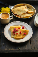 pancakes crepes fritters with raspberry berries (pancakes with filling) Shrovetide. food background. top view