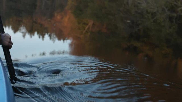Close-up of a canoe paddle at sunset