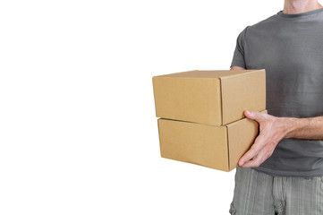 Caucasian man with gray tshirt carrying two parcel boxes on white background
