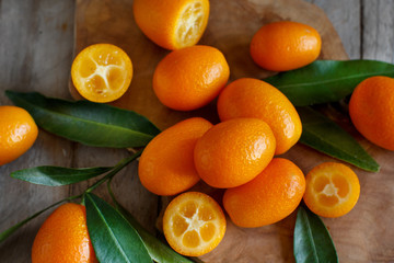 Kumquat fruits on a  wooden background