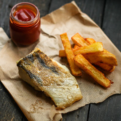Fish and Fries (white fish with vegetables, potatoes, portion). food background. copy space