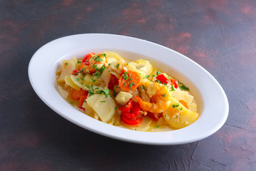 Shrimp stew with potato, paprika, carrot and onion