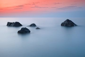 Fototapeta na wymiar Scenic seascape with beautiful sky and stones in the foreground, long exposure, Black Sea, Russia