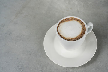 cup of coffee on concrete table