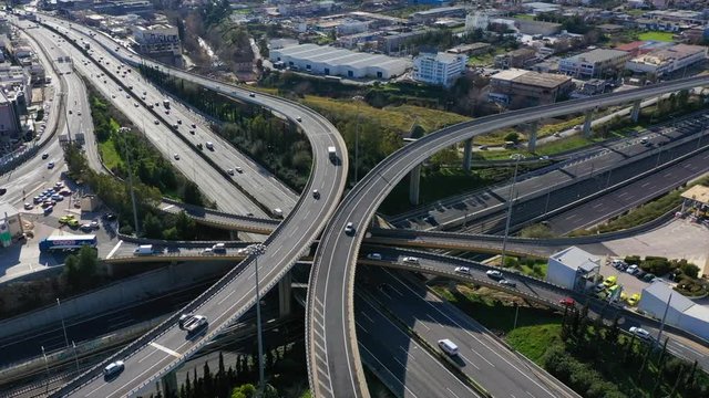 Aerial drone video of urban elevated toll road junction and interchange overpass in National road and Attiki odos of Attica, Athens, Greece