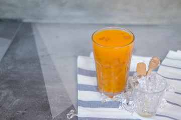 Freshly squeezed sweet orange juice with ice cubes