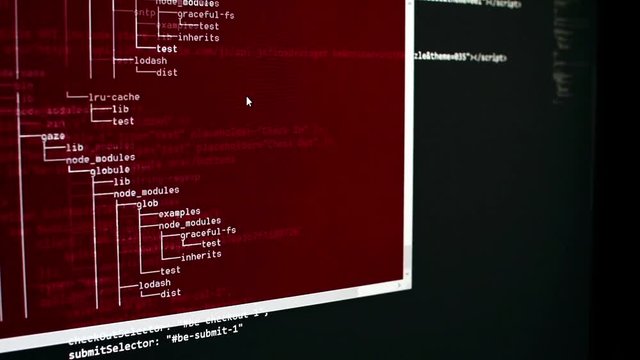 Scanning hard drive content by a shell. Computer analysis in a red window. List of file and number runs fast in a window, black backgournd with lines of code