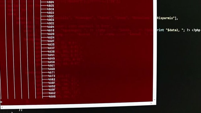 Scanning hard drive content by a shell. Computer analysis in a red window. List of file and number runs fast in a window, black backgournd with lines of code