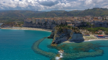 Obraz na płótnie Canvas Tropea, Calabria. Aerial view of city, monastery and coastline from drone perspective.