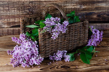 lilac basket wooden background side