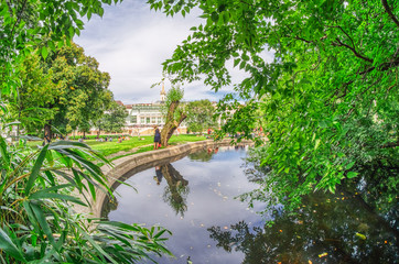VIENNA, AUSTRIA - JULY 2011: Tourists visit city park. Vienna attracts 10 million people annually