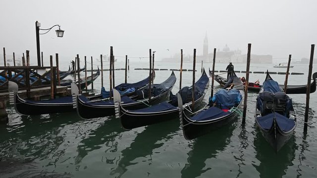 Venice, Italy - Palaces and Gondolas of the San Marco Basin wrapped in fog