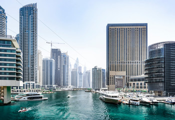 View of Dubai Marina - an cityscape with a blue bay, yachts and skyscrapers, Dubai, UAE, Jun.2018