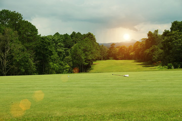 Obraz premium Background evening golf course has sunlight shining down at golf course in Thailand