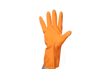 Hand in orange rubber glove shows a sign or symbol five fifth.