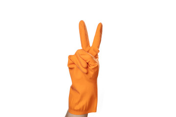 Hand in orange rubber glove shows a sign or symbol Two second.