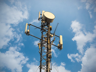 Base Station or Base Transceiver Station. Telecommunication tower. Wireless Communication Antenna Transmitter. Telecommunication tower with antennas against blue sky.