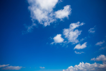 Naklejka na ściany i meble Blue sky background with tiny clouds in sunny day.