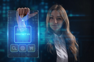 The concept of business, technology, the Internet and the network. A young entrepreneur working on a virtual screen of the future and sees the inscription: Contact us