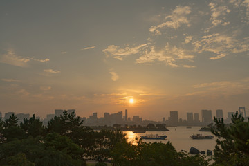 Buildings in city at sunset.