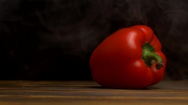 Fresh and ripe paprika on a black background from the refrigerator, coolness and freshness, close-up, copy space, natural, 4K