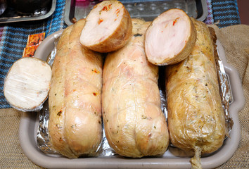 Sticks of boiled sausage placed on a counter