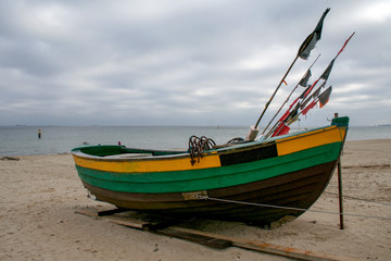Naklejka na ściany i meble Fishing boat on the beach at the Baltic Sea