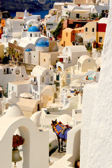 The village of Oia on Santorini with colorful iconic buildings and spectacular views. 