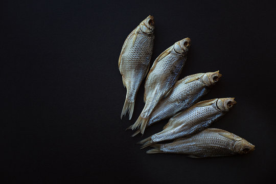dried salted fish vobla on a black background. Caspian roach