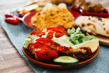 Traditional Indian food chicken tandoori and Tikka with garlic naan
