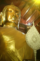 Buddha in the church is adorned with a beautiful light.