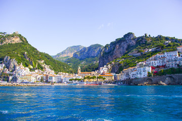 Fototapeta na wymiar View from the sea on the cozy and cute town Amalfi, Italy. 