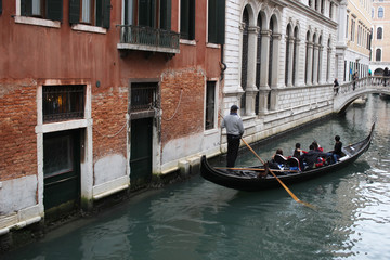 Fototapeta na wymiar Chinese Tourism sailing travel by Gondola at Grand Canal Venice surrounding by historical attractive building, Venice, Italy, Commercial advertisement for day trip boat in Europe