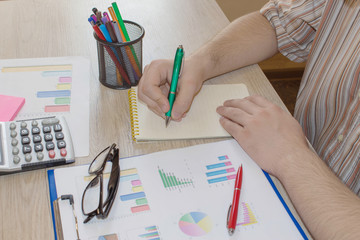 accounting and business concept. Businessman working on office desk. Home finances, investment, economy, saving money