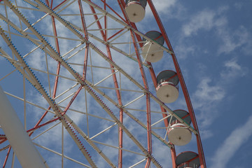 Brightly colored Ferris wheel. Ferris wheel on a bright sunny day