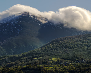 Low clouds stick to the summits of the mountains