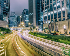 Obraz premium HONG KONG - MAY 10, 2014: City traffic at night. Hong Kong hosts 10 million tourists every year