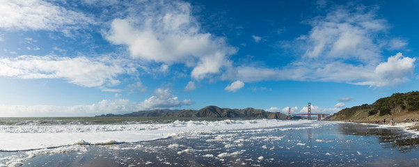Panorama of Baker Beach and the Golden Gate Bridge in San Francisco California.