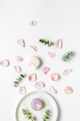 light breakfast disign with flowers on white table top view