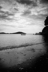 Wooden rowing boat in a bay, Skiathos, Greece.