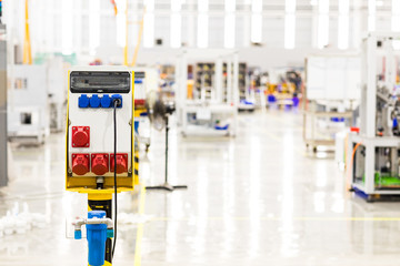 Electric Power Distribution Unit plug cable for Server computer in modern interior of data center.