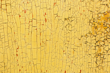 Peeling paint on old wooden rustic material on the wall.
