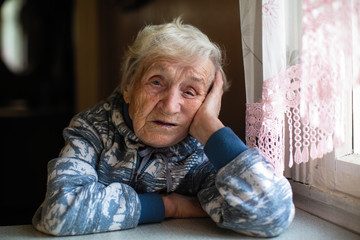 Portrait of a melancholy elderly woman.