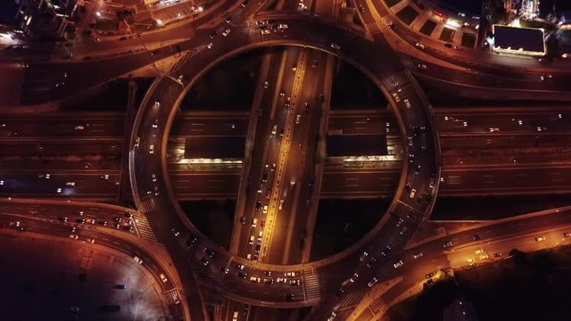 Aerial night video of ring road passing through city center