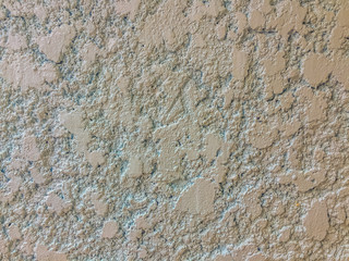 Stucco mortar plastered wall texture with grey and rough surface background.
