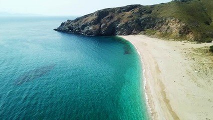 Aerial drone bird's eye view video of iconic beach of Potami or River with turquoise clear waters, South Evia island, Greece